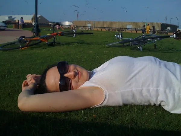 Relaxing on the grass at the pier