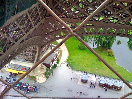 Looking down from the Eiffel Tower. The line for the elevator was long and it was rainy and cold — we walked up instead.